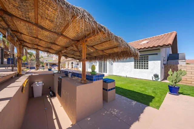 a view of a chairs and table in a patio