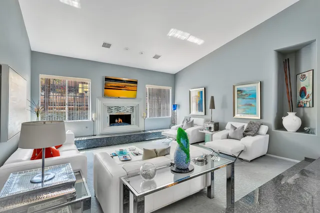 a kitchen with stainless steel appliances granite countertop a sink refrigerator and cabinets