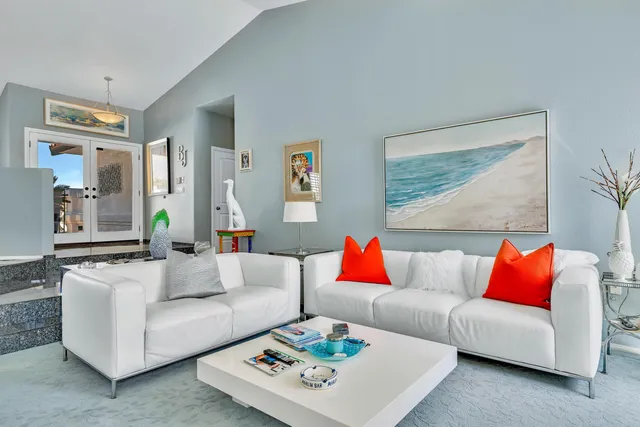 a dining room with furniture a fireplace and wooden floor