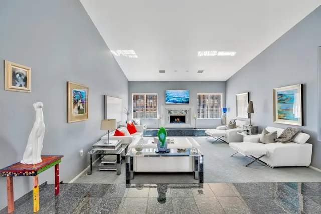 a living room with furniture a fireplace