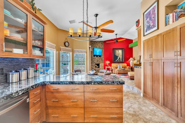 a bedroom with a large bed a flat screen tv and a walk in closet