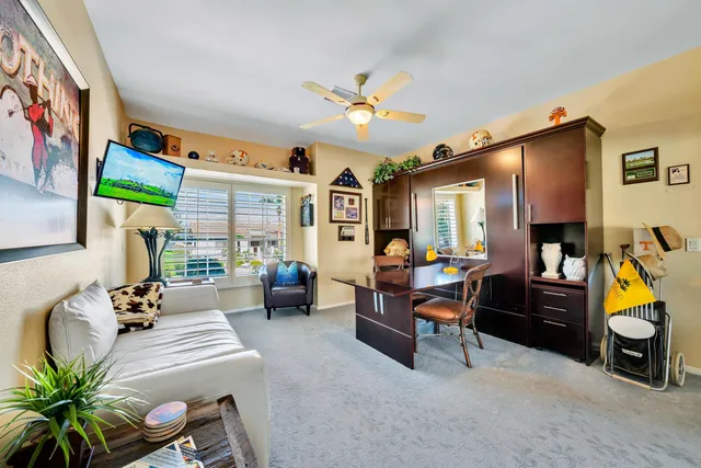 a view of swimming pool with a patio and a garden