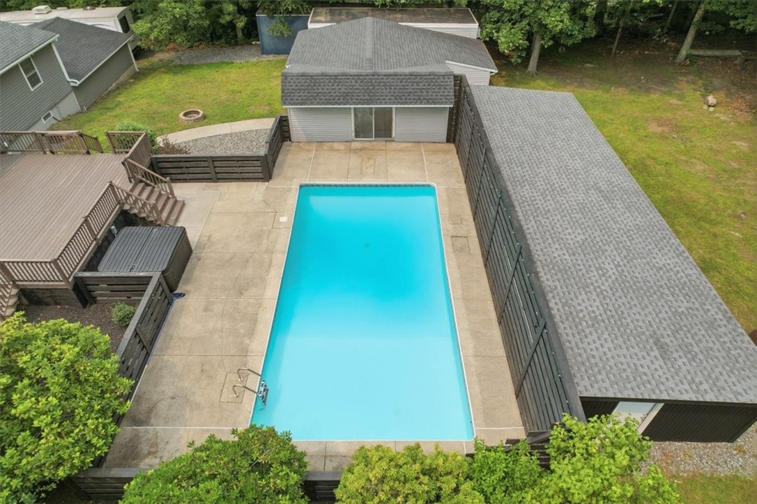 214 Anan Wade Road Glocester, RI 02857 - Photo 39 of 50 Private, spacious and loaded with amenities, the backyard offers an exceptional outdoor lifestyle with pool, hot tub, multiple gathering areas and room to roam.