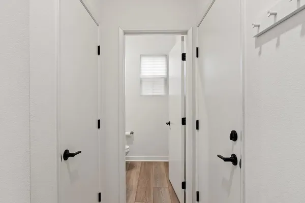 a bathroom with a glass shower door