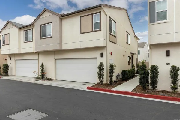 a front view of a house with a garage