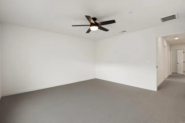 a spacious bathroom with a shower sink vanity and mirror