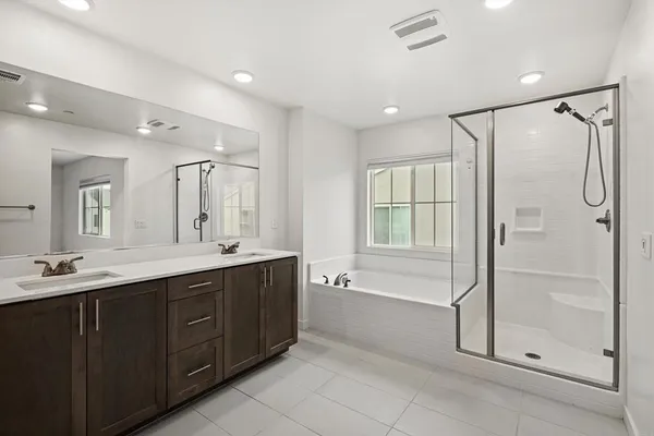 a view of a hallway with closet and wooden floor