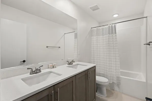a view of a patio with table and chairs and potted plants