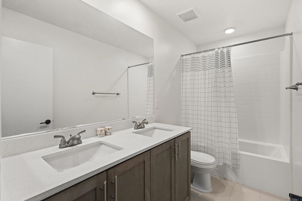 227 Canopy Trails Place Fallbrook, CA 92028 - Photo 30 of 66 a bathroom with a sink a toilet and shower