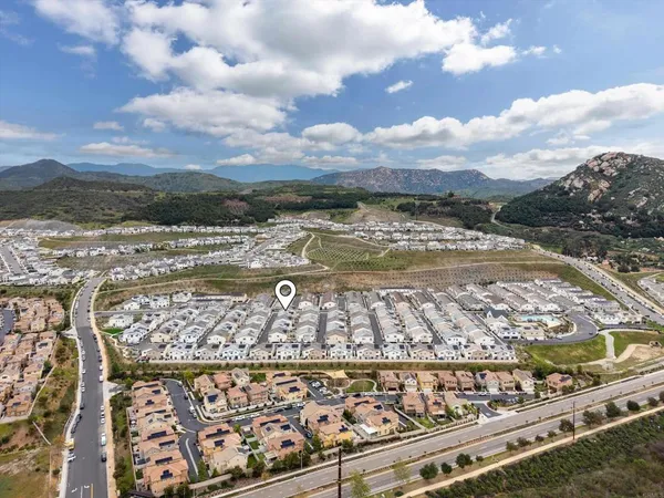 a view of staircase with white walls and a window