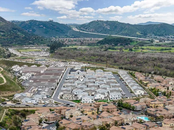 a view of a patio with table and chairs and potted plants