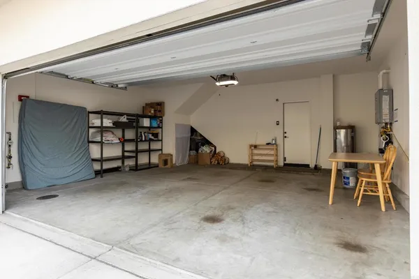 a view of a patio with swimming pool and sitting area