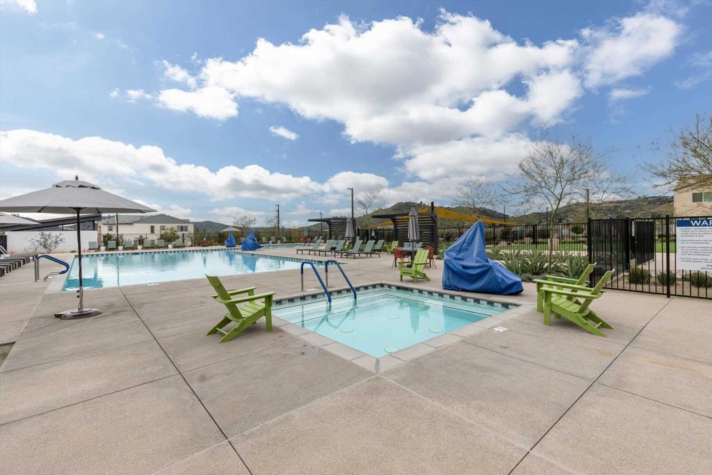 227 Canopy Trails Place Fallbrook, CA 92028 - Photo 61 of 66 a view of a patio with swimming pool and sitting area