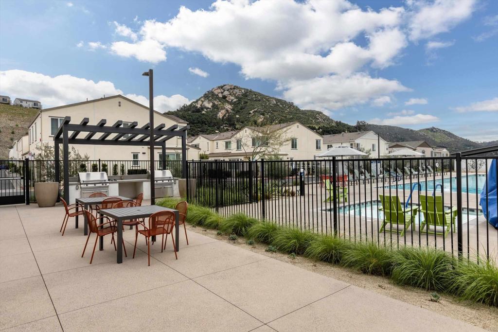 227 Canopy Trails Place Fallbrook, CA 92028 - Photo 62 of 66 a view of a patio with a table and chairs