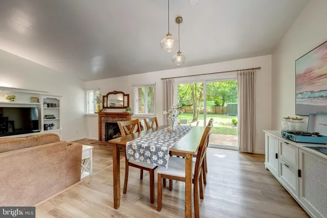 a view of a livingroom with furniture window and wooden floor