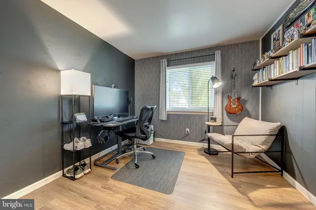 a work room with furniture and a window