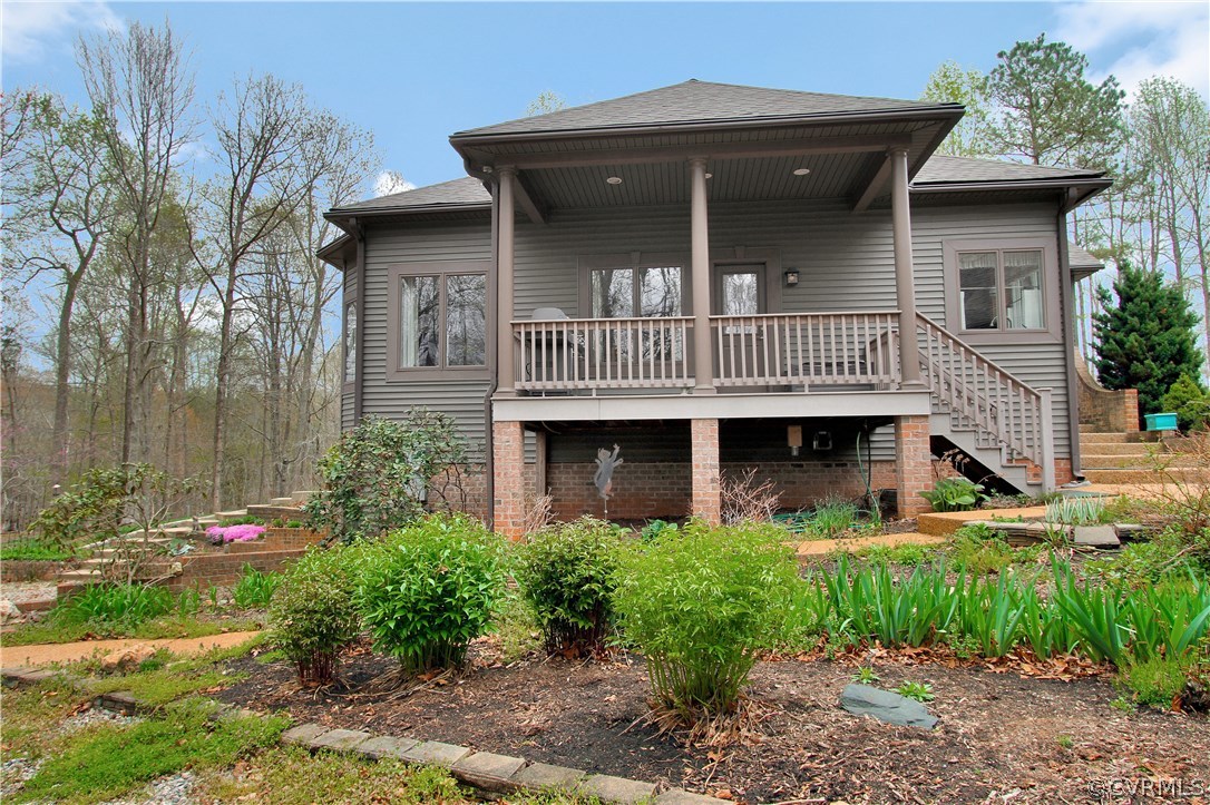 12412 Bundle Road Chesterfield, VA 23838 - Photo 35 of 37 a view of a house with brick walls and flower plants