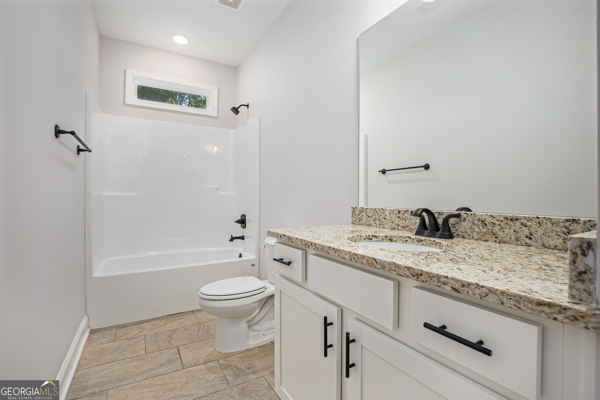 138 Crest Pointe Bremen, GA 30110 - Photo 19 of 22 a bathroom with a granite countertop sink a toilet and a bathtub