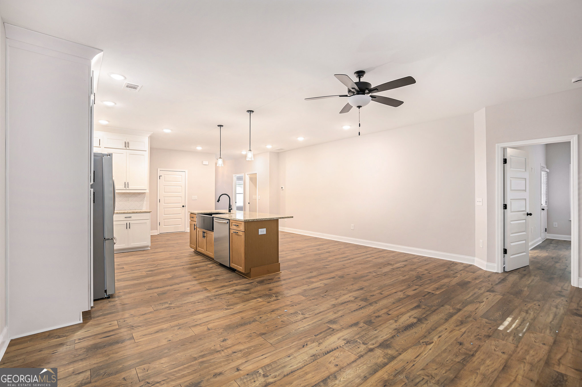 138 Crest Pointe Bremen, GA 30110 - Photo 5 of 22 a view of a kitchen with a sink and refrigerator