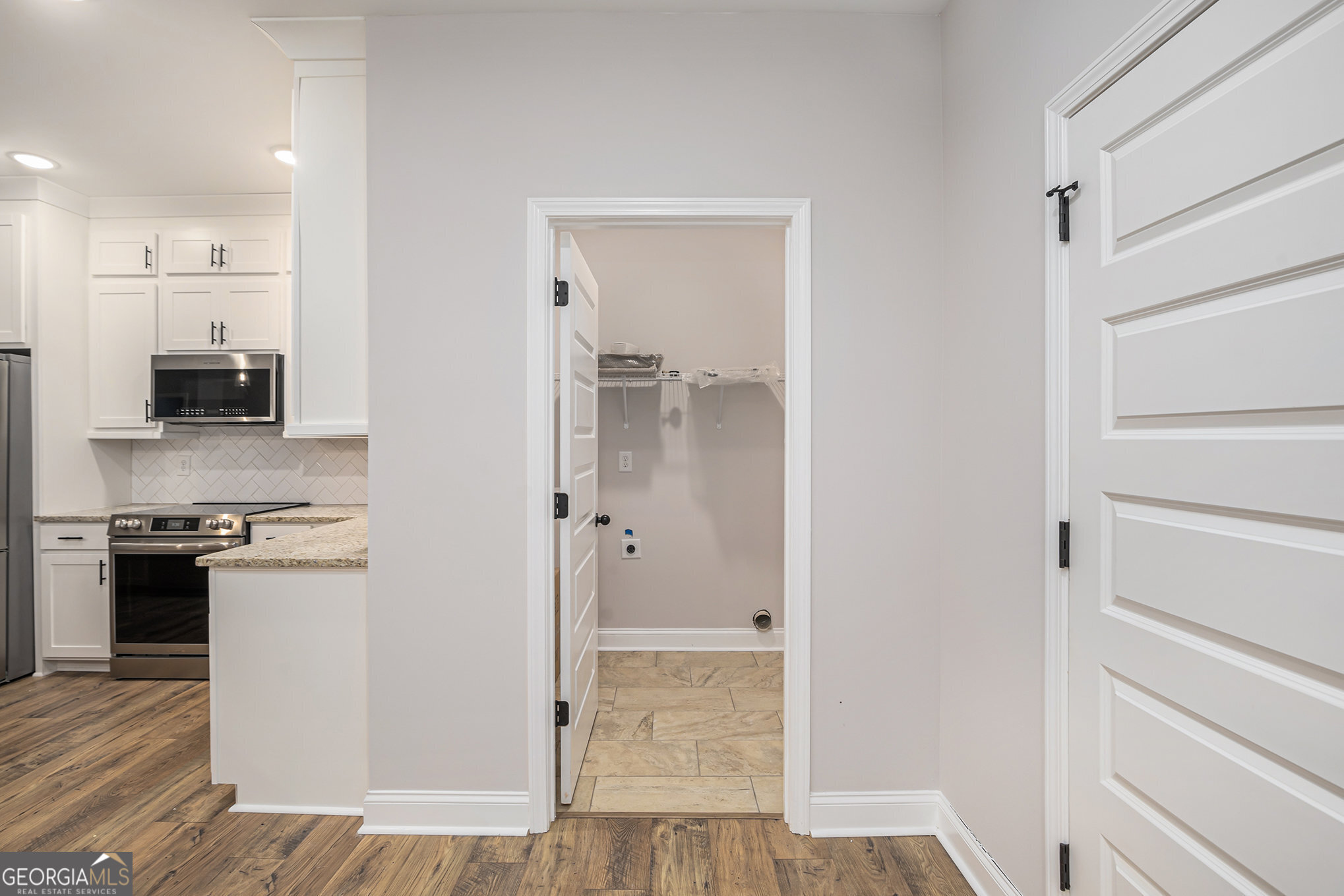 138 Crest Pointe Bremen, GA 30110 - Photo 7 of 22 a kitchen with stainless steel appliances granite countertop a refrigerator and a stove top oven