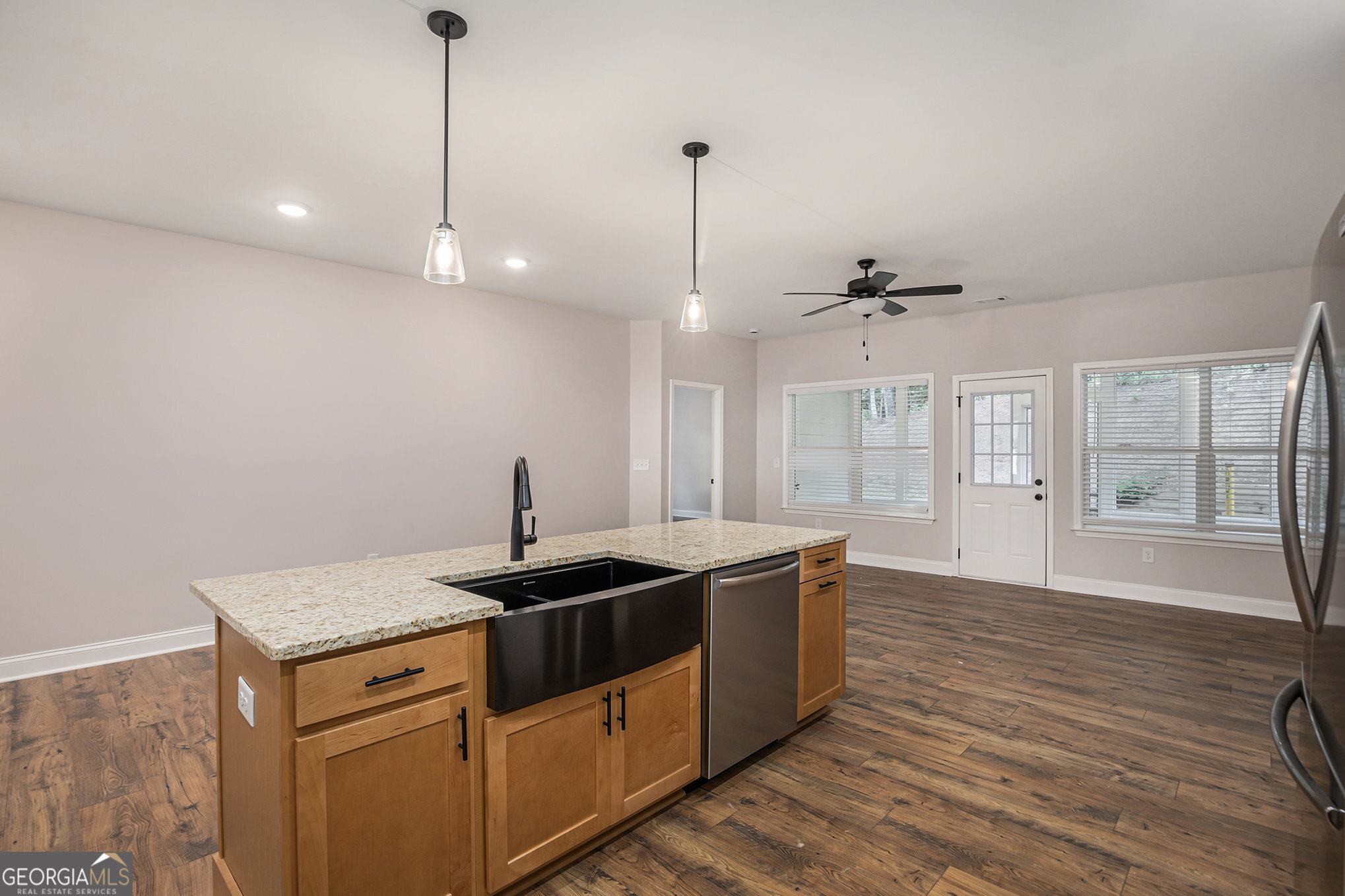 138 Crest Pointe Bremen, GA 30110 - Photo 9 of 22 a kitchen with stainless steel appliances granite countertop a sink a stove and a wooden floor