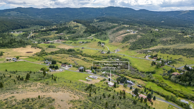 322 Bailey Creek Road Soda Springs, ID 83276 - Photo 2 of 32 Expansive rural landscape featuring a mix of open fields and forested hillsides