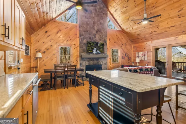a view of a patio with dining table and chairs