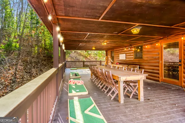 a view of a chairs and table in the balcony