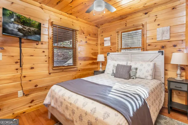 a bathroom with a granite countertop toilet sink and mirror