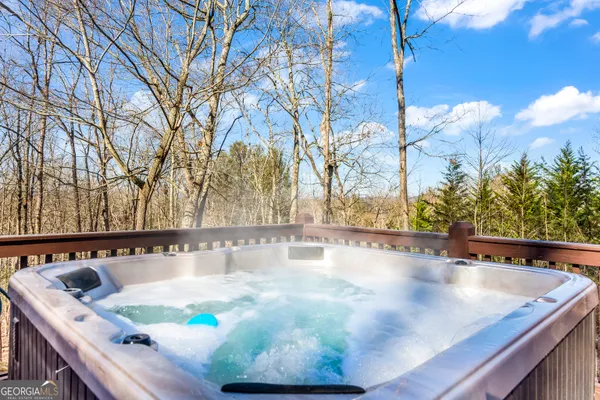 a view of a chairs and table on the wooden floor