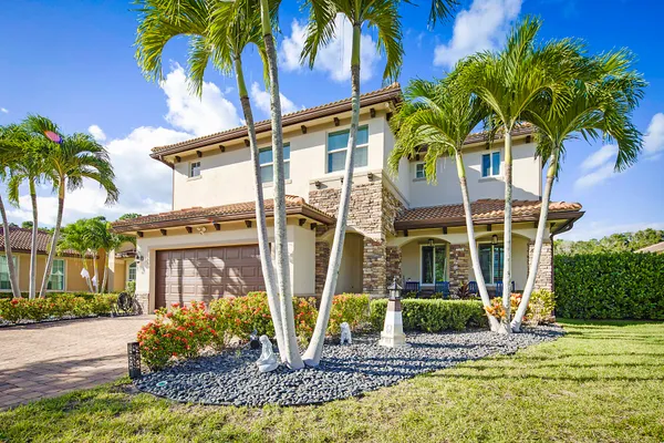 a front view of a house with a yard