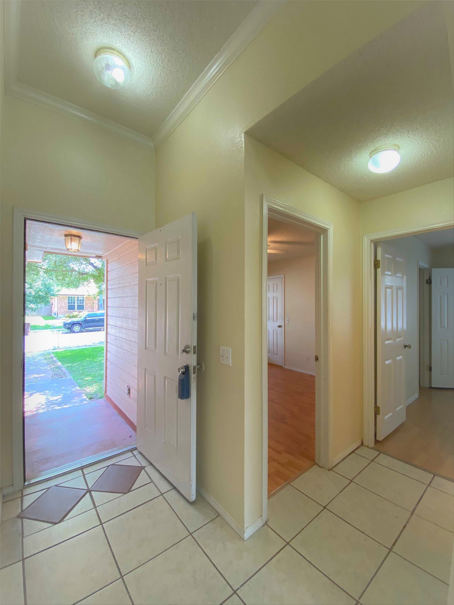 1903 Balsam Way Round Rock, TX 78665 - Photo 17 of 21 A welcoming entryway with tile flooring transitions to rich wood flooring beyond.