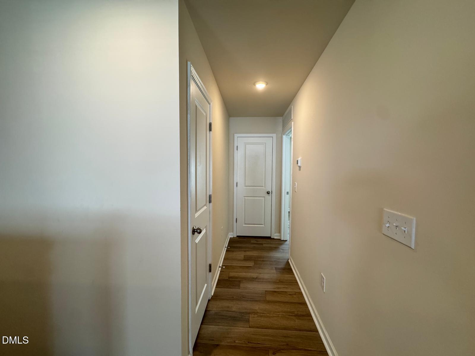 3440 Pinnacle Peak Drive Raleigh, NC 27604 - Photo 16 of 31 a view of a hallway with wooden floor