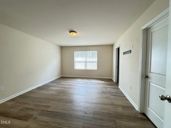 a view of an empty room and window