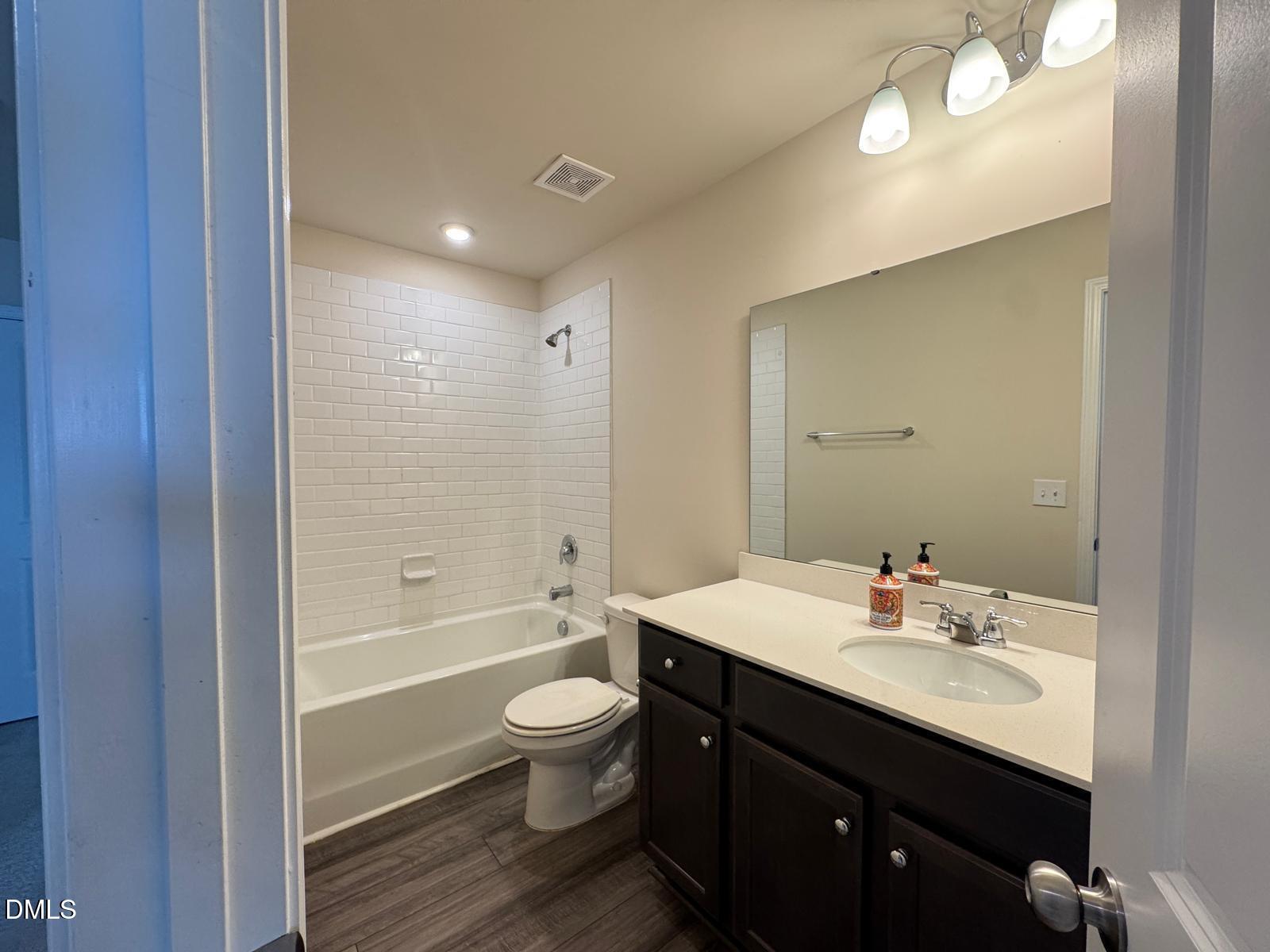 3440 Pinnacle Peak Drive Raleigh, NC 27604 - Photo 23 of 31 a bathroom with a sink shower and a toilet