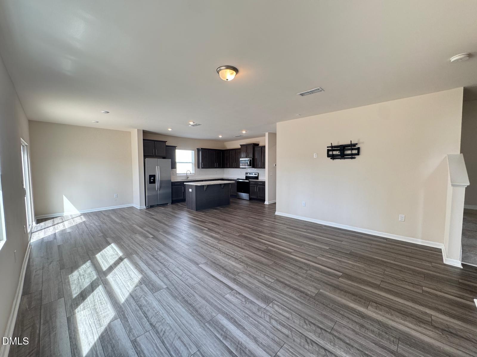 3440 Pinnacle Peak Drive Raleigh, NC 27604 - Photo 4 of 31 a view of empty room with wooden floor