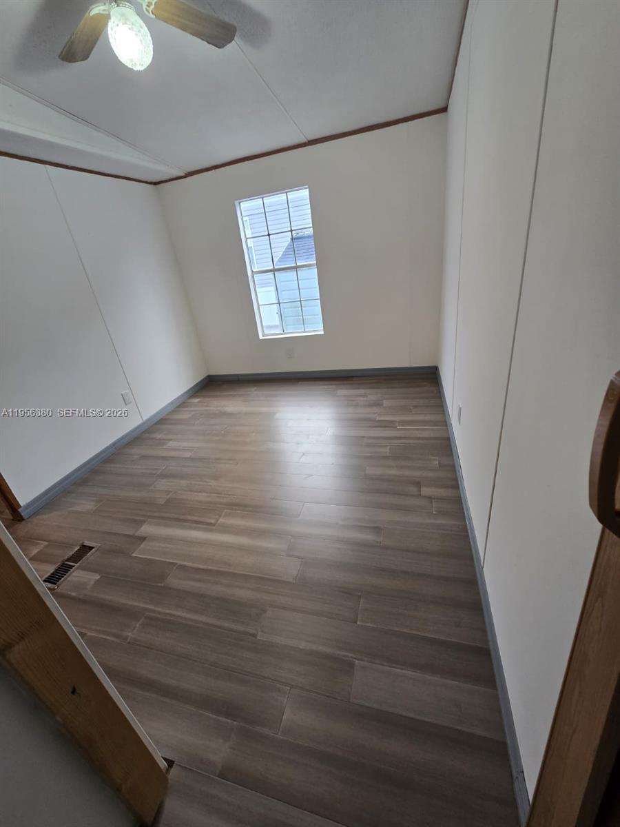 17350 Southwest 232nd Street, Unit 41 Miami, FL 33170 - Photo 13 of 15 a view of an empty room with a window