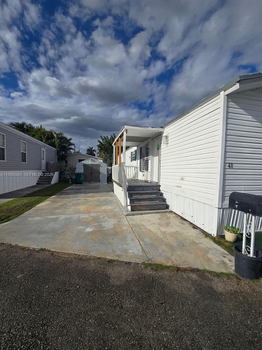 17350 Southwest 232nd Street, Unit 41 Miami, FL 33170 - Photo 3 of 15 a view of a house with a backyard