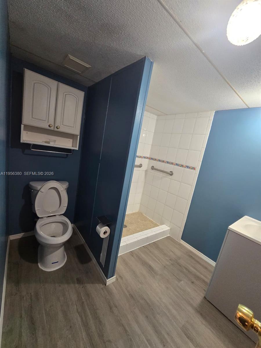 17350 Southwest 232nd Street, Unit 41 Miami, FL 33170 - Photo 9 of 15 a view of washer and dryer with wooden floor