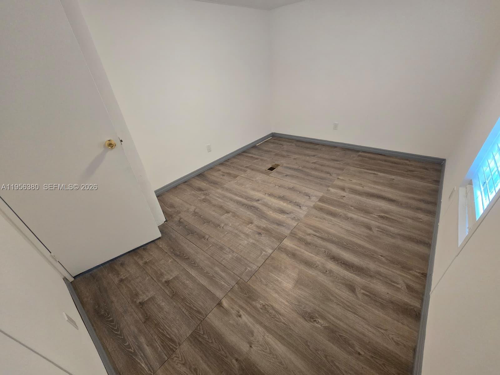17350 Southwest 232nd Street, Unit 41 Miami, FL 33170 - Photo 10 of 15 an empty room with a bench