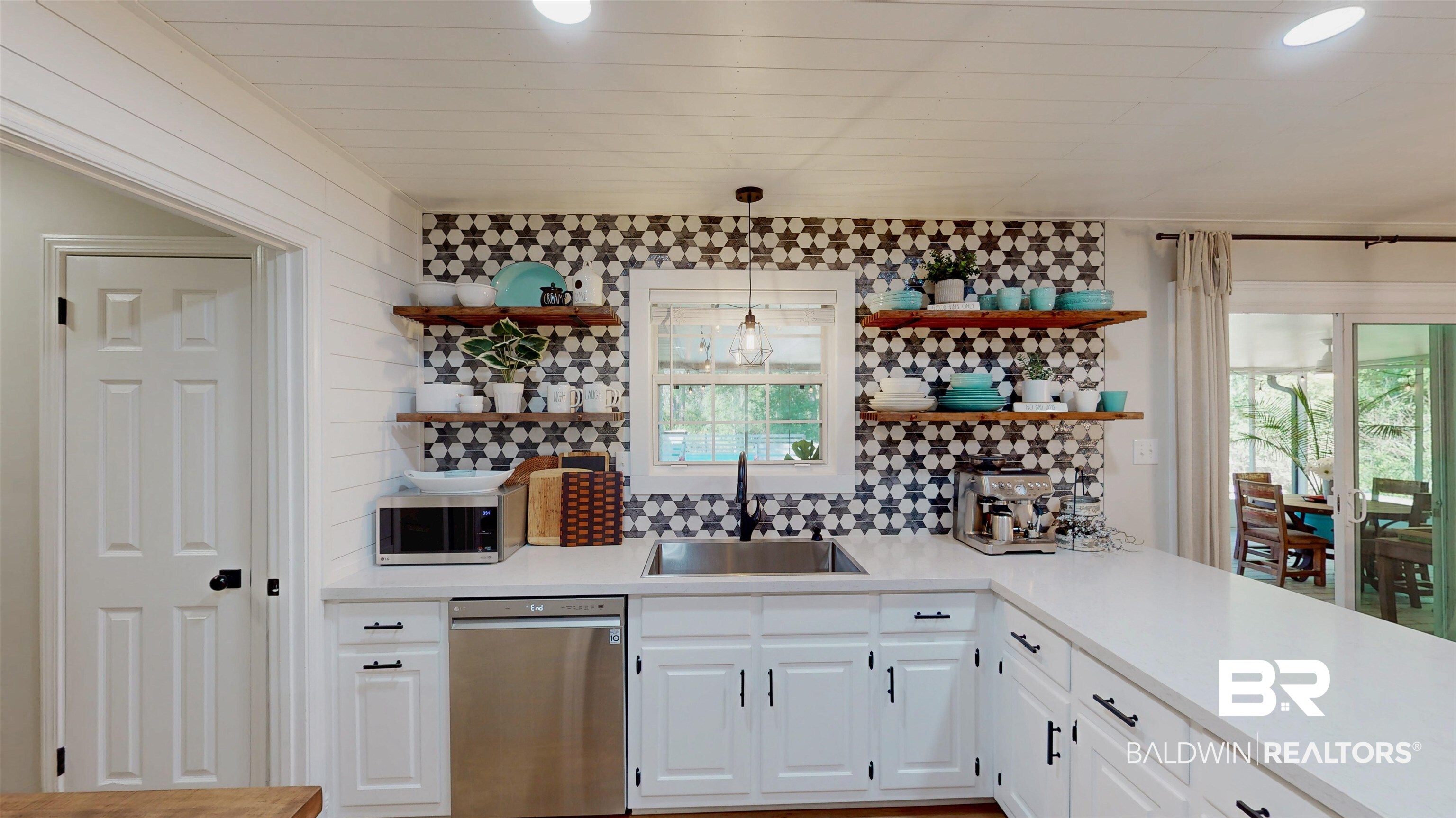 9902 Clarke Ridge Road Foley, AL 36535 - Photo 22 of 61 Bar with tasteful backsplash, a sink, hanging light fixtures, stainless steel appliances, and recessed lighting