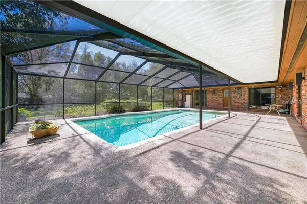 a view of yard with a patio