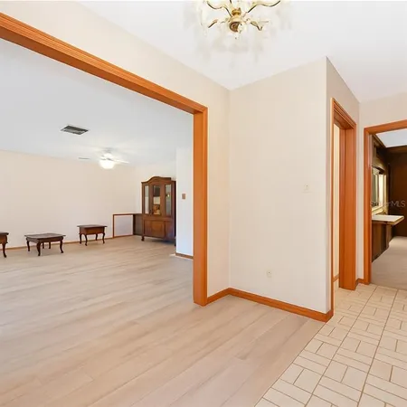 a view of a livingroom with a furniture and ceiling fan