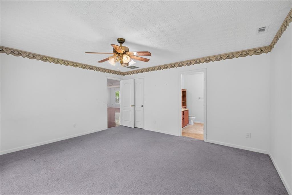 602 Pendergrass Road Winder, GA 30680 - Photo 23 of 44 a view of a room with wooden floor