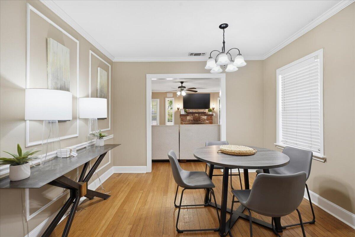 2702 20th Street Lubbock, TX 79410 - Photo 11 of 34 a view of a dining room with furniture and wooden floor