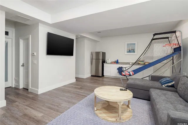 a living room with a flat screen tv and a couch