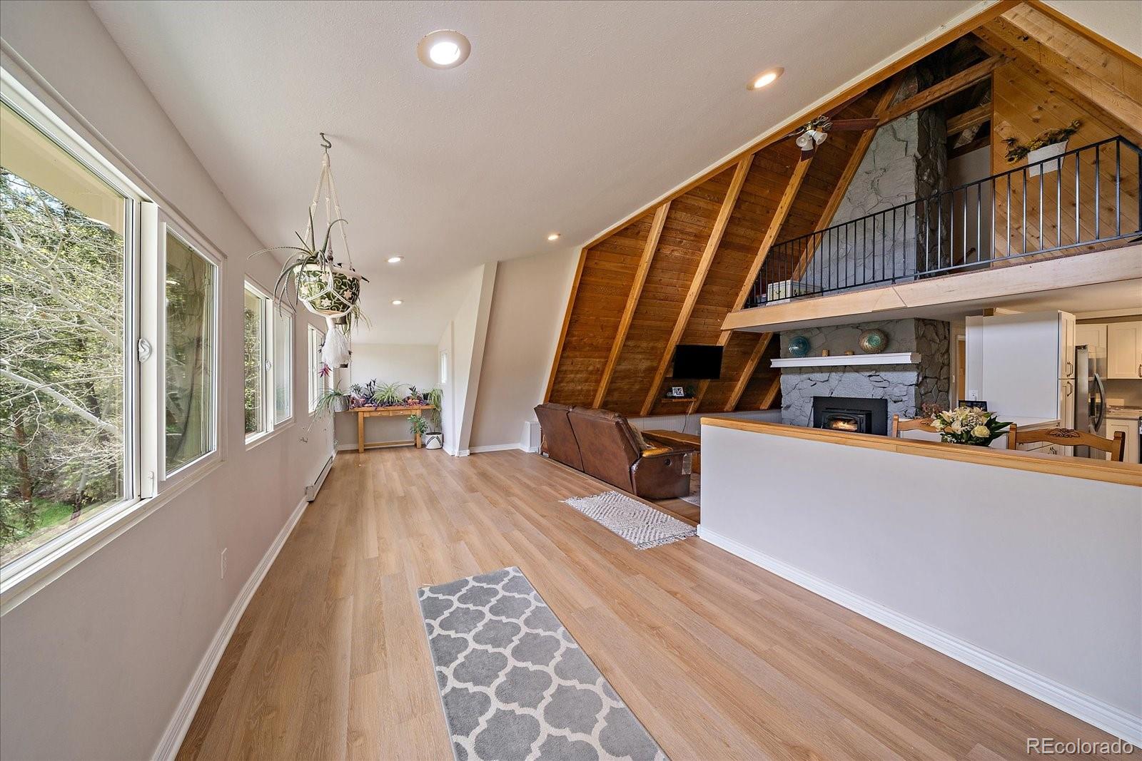 307 Snyder Mountain Road Evergreen, CO 80439 - Photo 7 of 41 a view of a living room