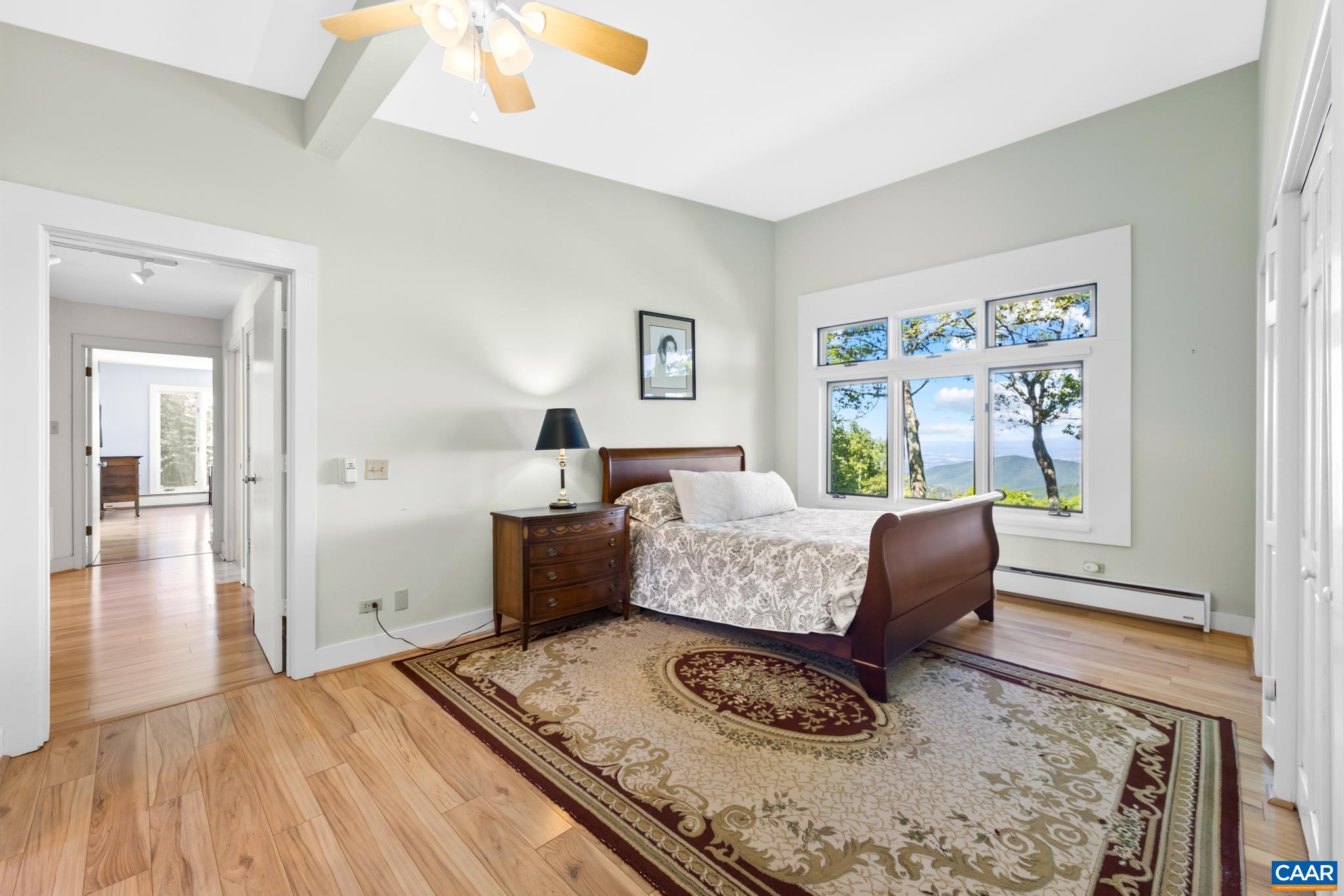 7098 Bucks Elbow Mountain Road Crozet, VA 22932 - Photo 29 of 57 a living room with furniture and a large window