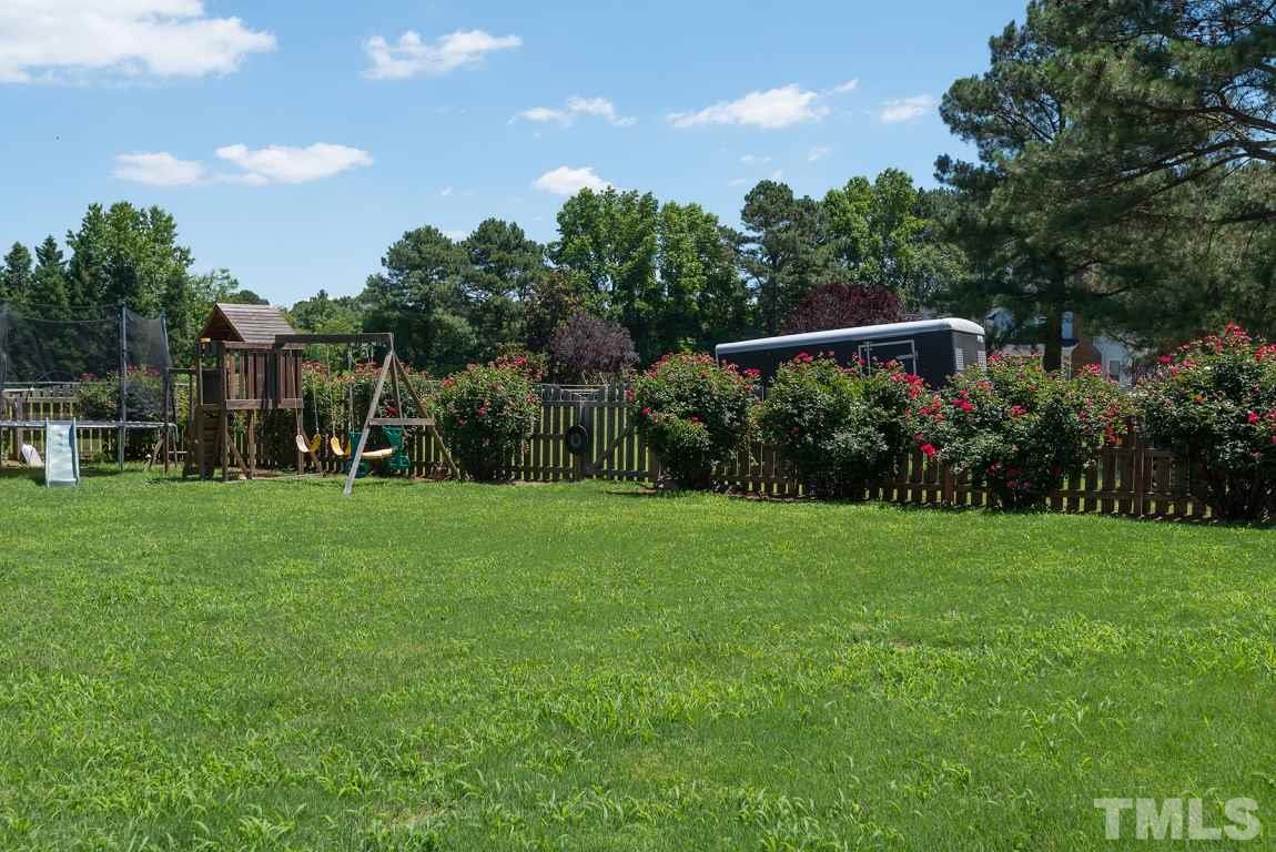 1901 Nikki Te Road Willow Spring, NC 27592 - Photo 22 of 25 a view of an house with backyard space and garden