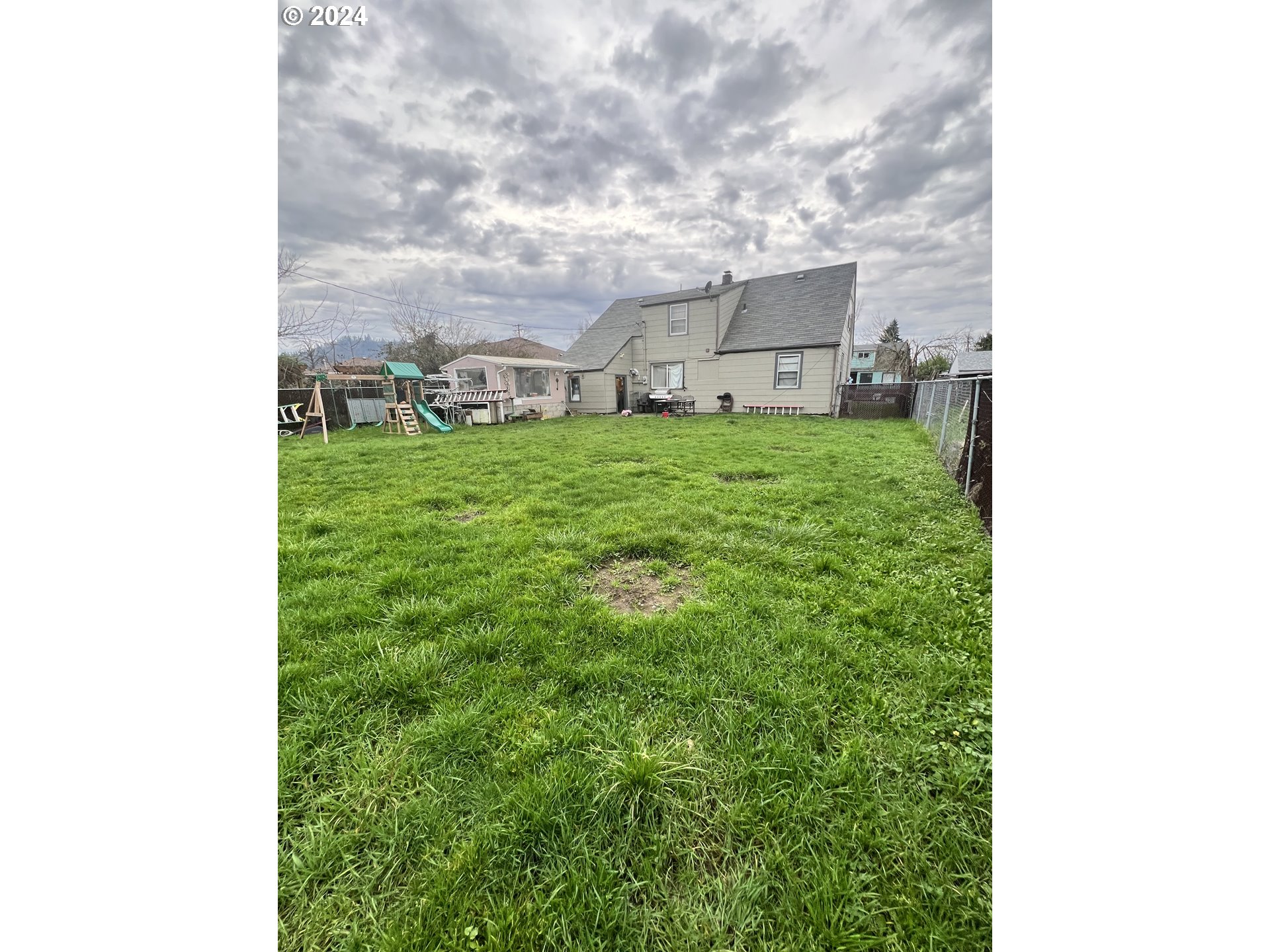 271 22nd Street Springfield, OR 97477 - Photo 20 of 28 a view of a yard in front of a house
